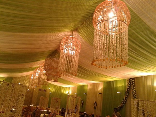 Draped pandal ceiling with chandeliers