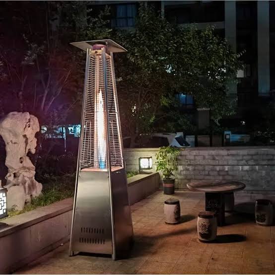Pyramid flame patio heater lit at night
