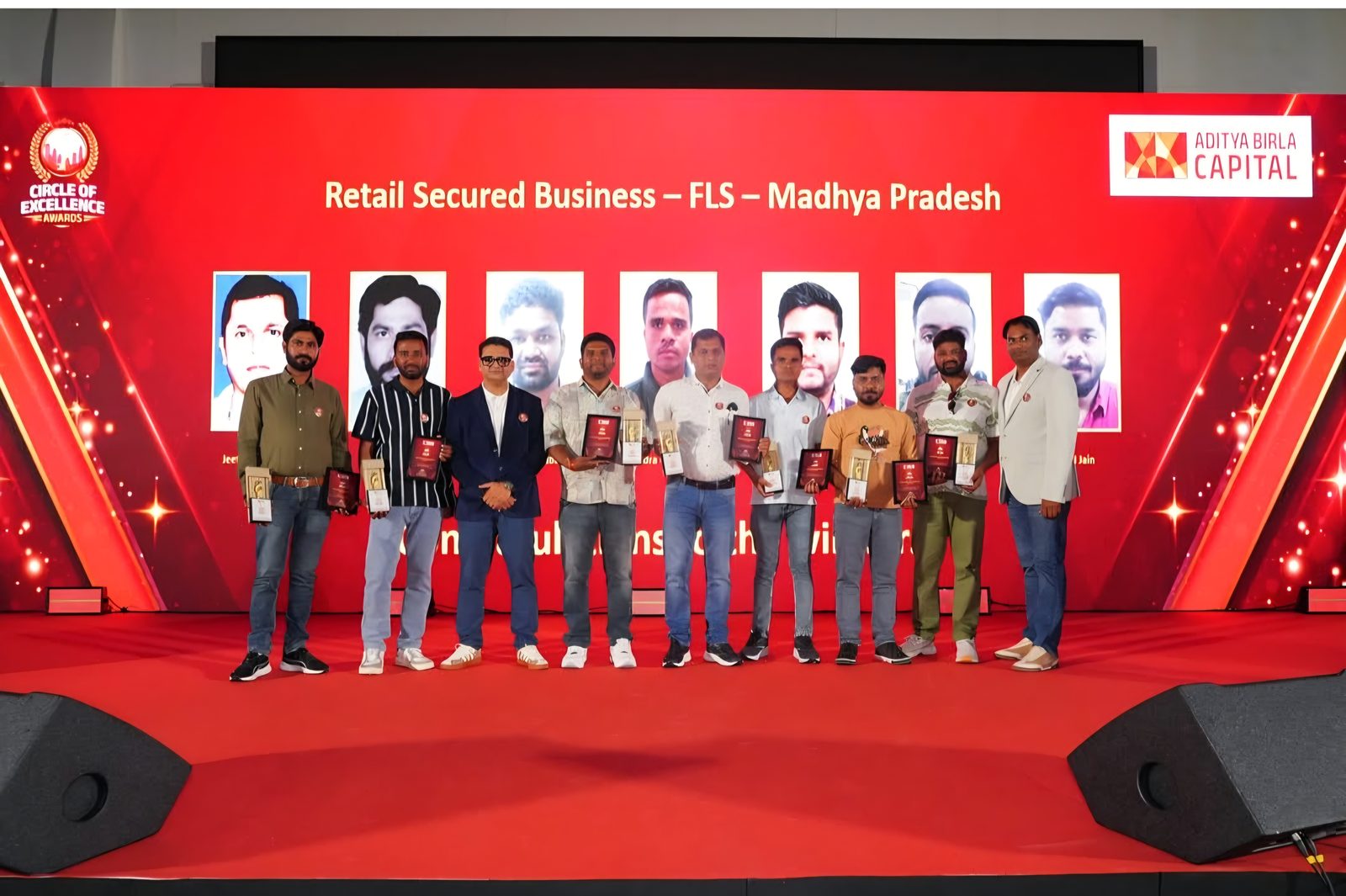 Award winners on the stage at a regional business meet