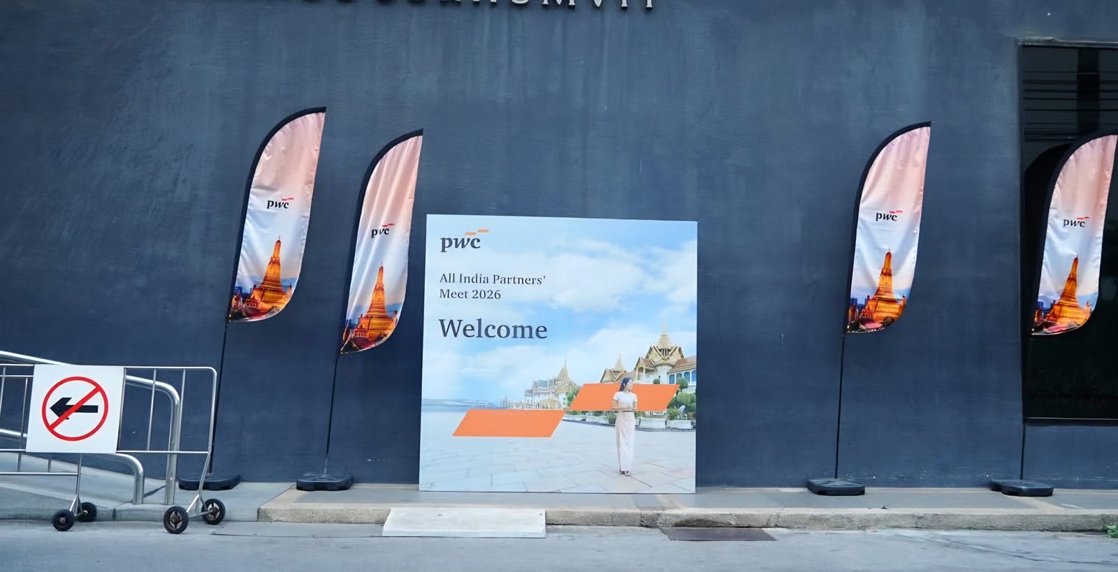 Welcome flags and signage outside the venue