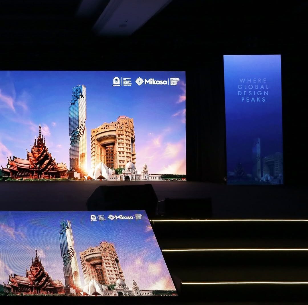 Summit stage with a city skyline on the LED wall