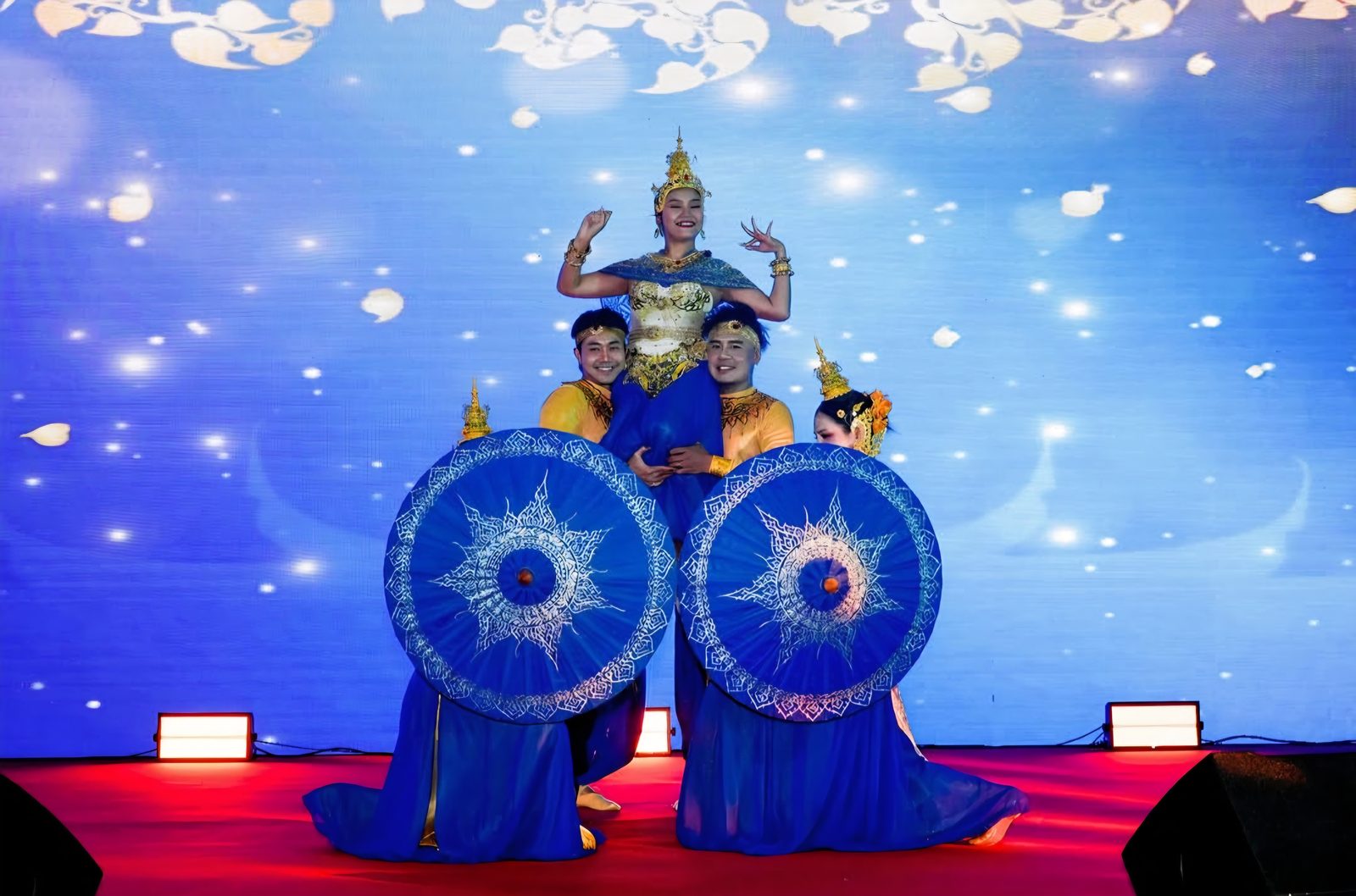 Costumed performers opening a themed corporate stage